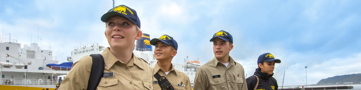 Four cadets smiling and walking