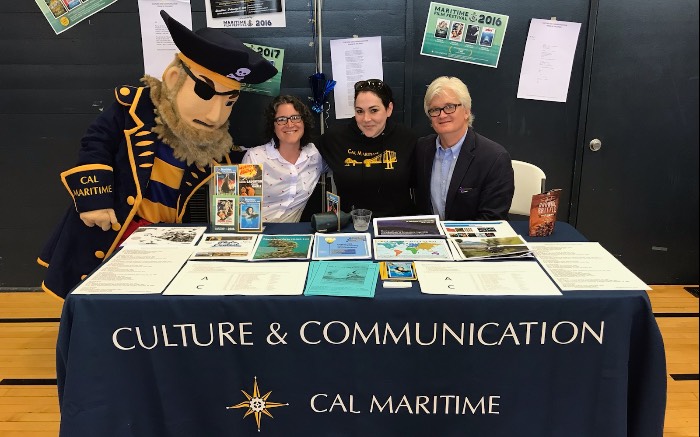 Culture and Communication Faculty posing at Keema the Bear in the quad