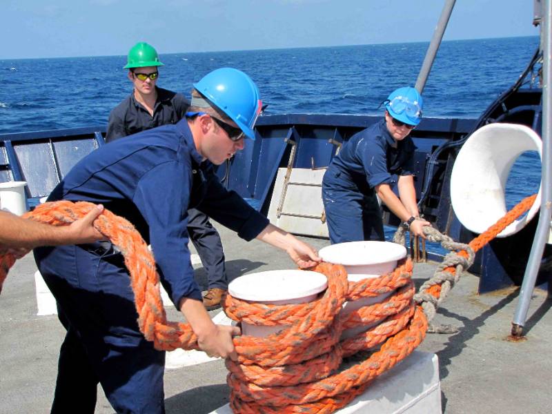 Cadets work on a ship